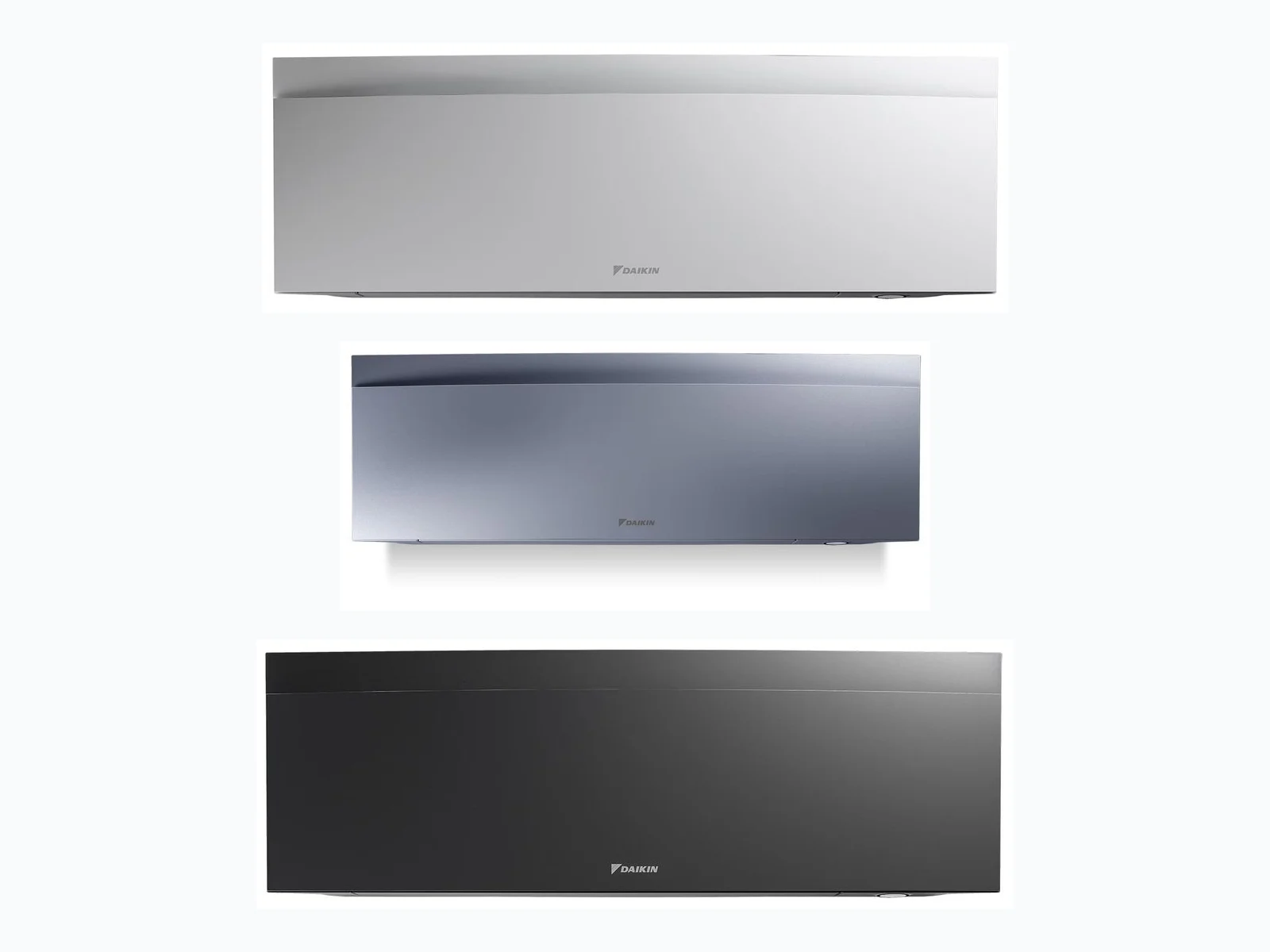 Daikin Emura in drie kleuren — mat wit, zilver en mat zwart naast elkaar